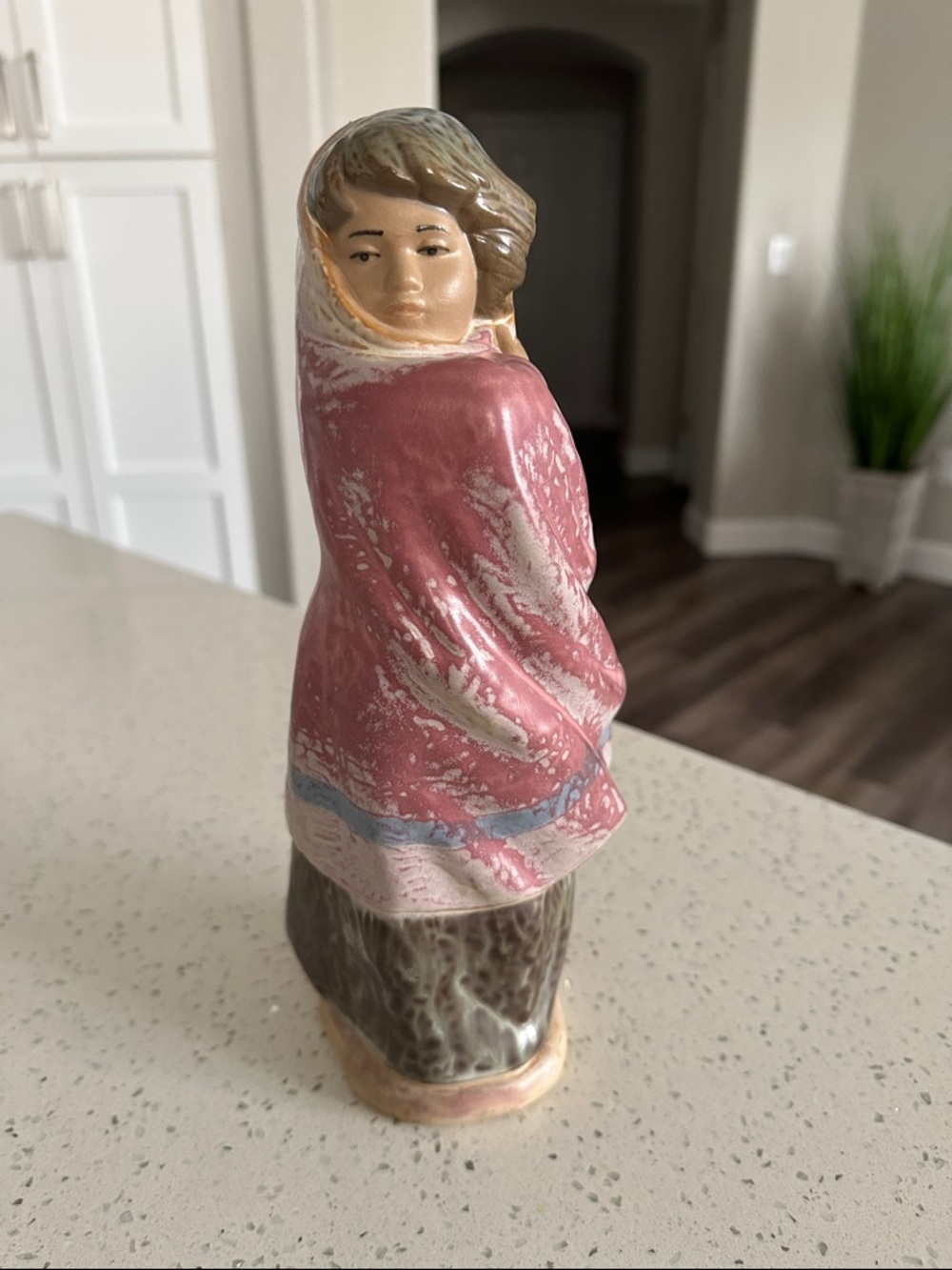 NAO by Lladro woman facing the wind wrapped up- Clay Art-